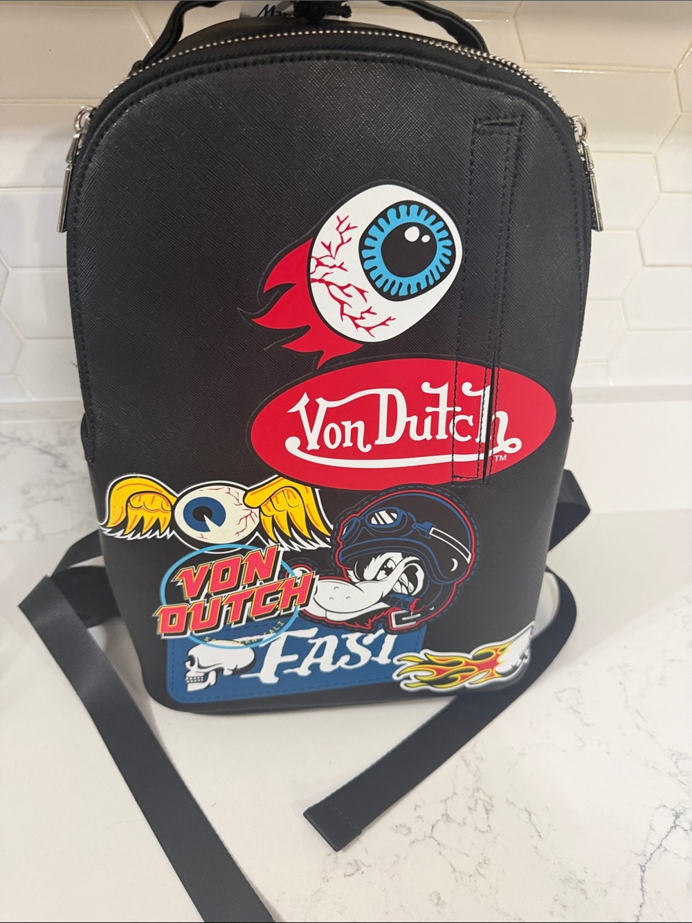 Von Dutch Black Sling Bag with Red, Blue and Yellow Graphics